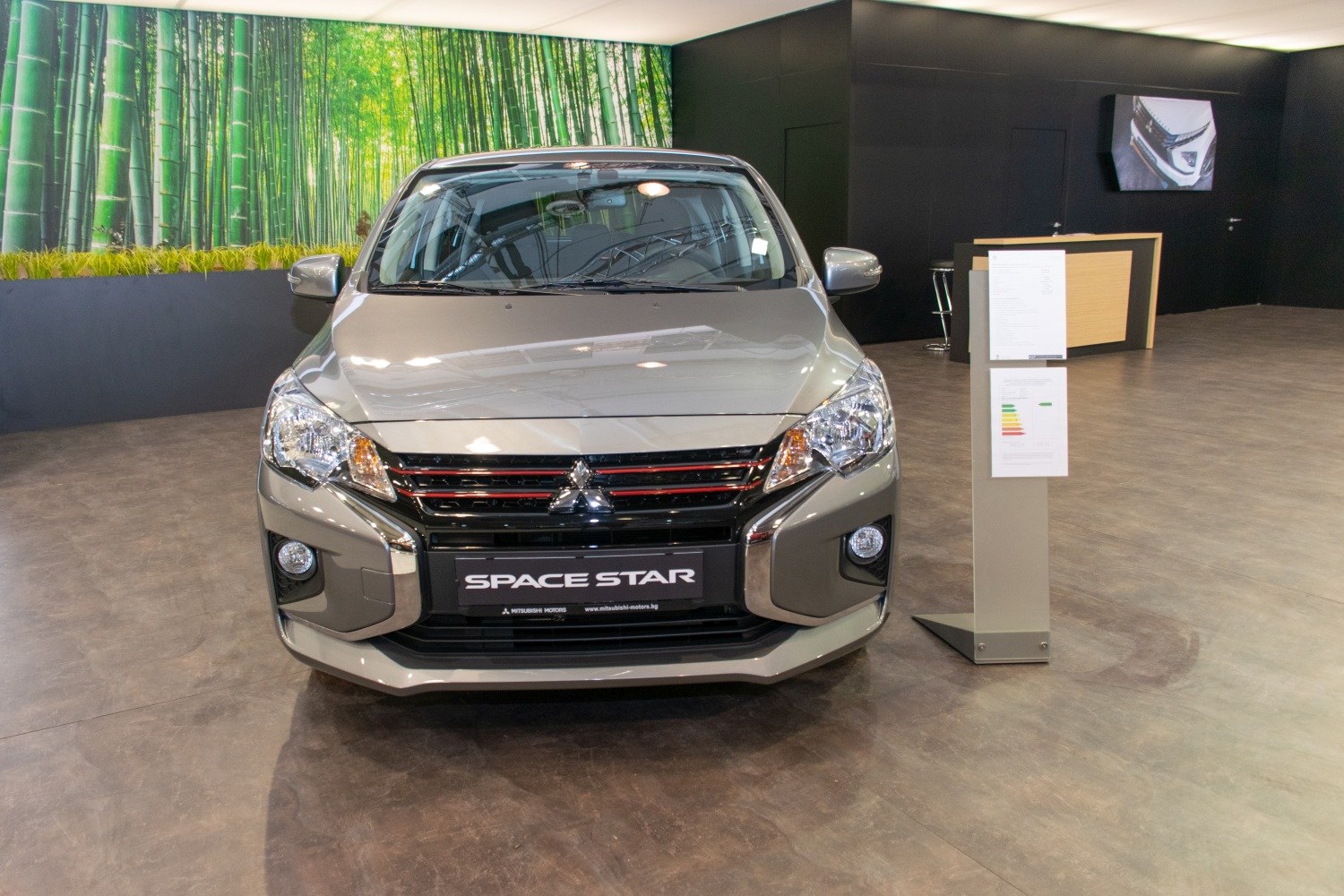 Front view with grille and headlights of facelifted compact car