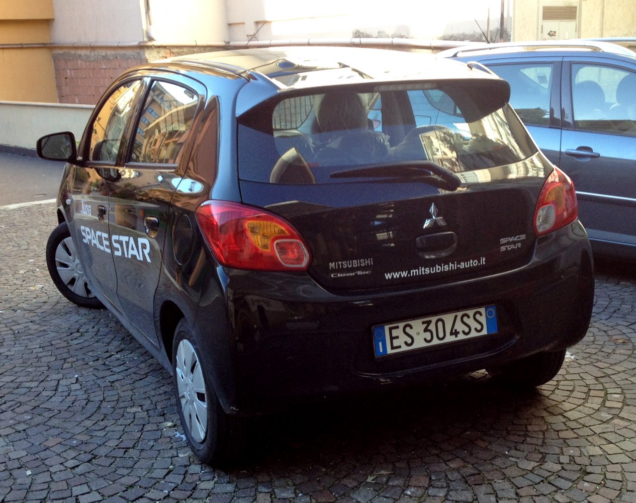 Rear and side view of compact hatchback with distinctive taillights