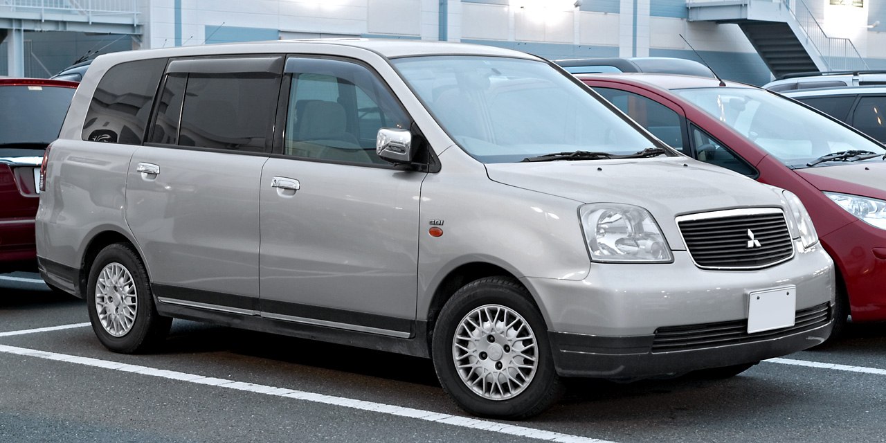 Silver multi-purpose vehicle front side profile with distinctive grille and alloy wheels