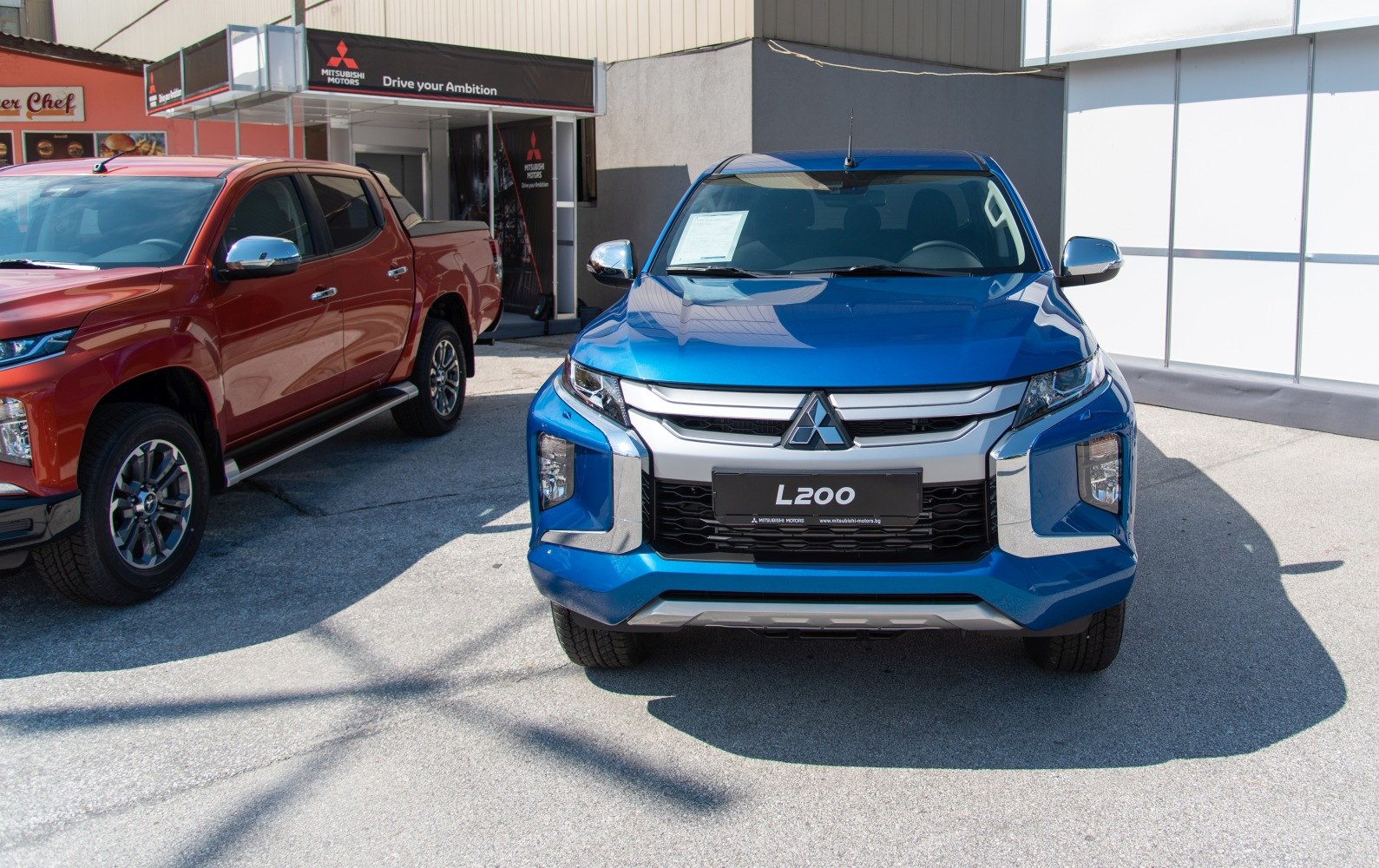 Front view of a modern pickup truck with prominent grille and headlights