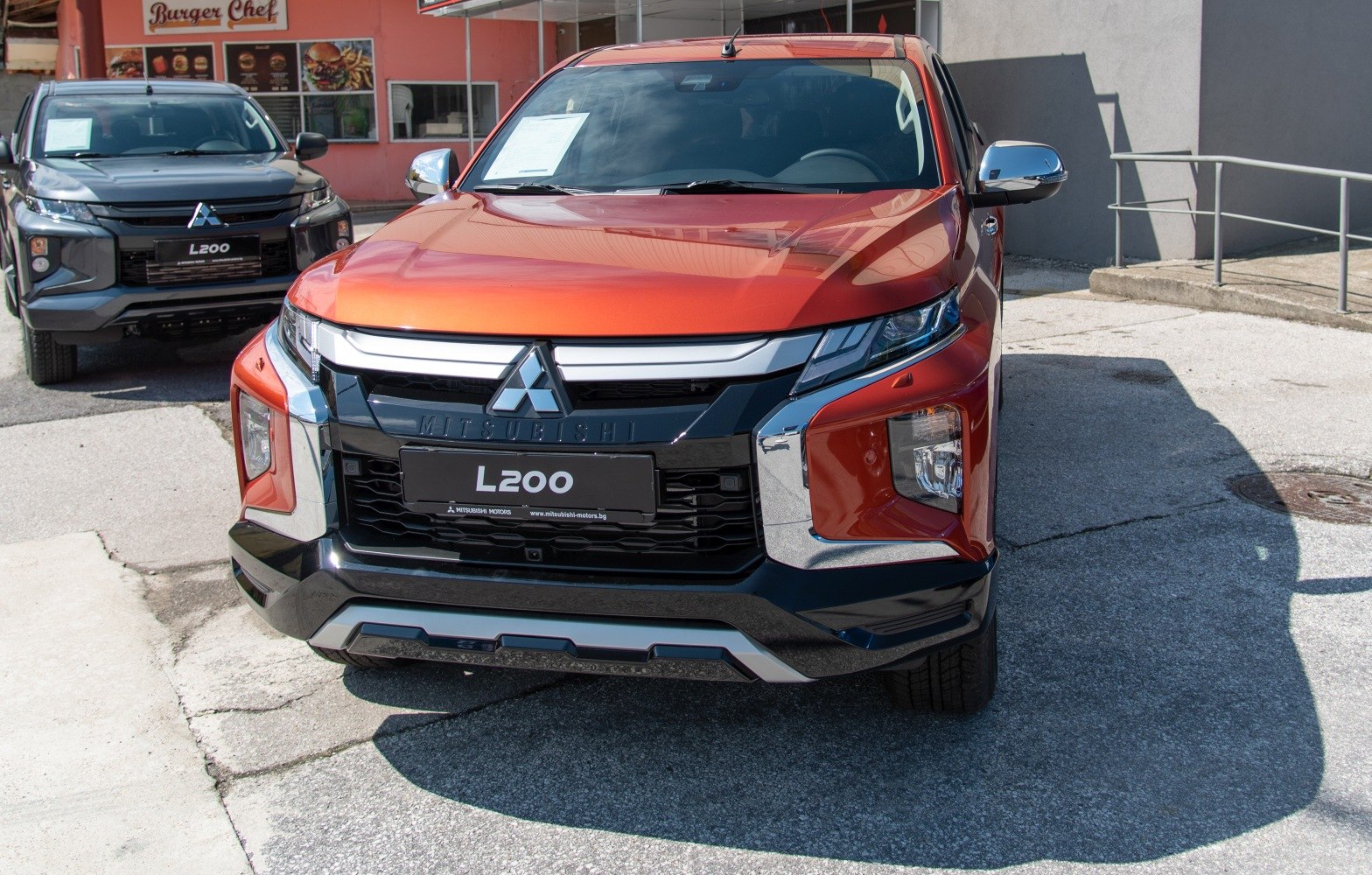 Front view of pickup with bold grille and angular headlights