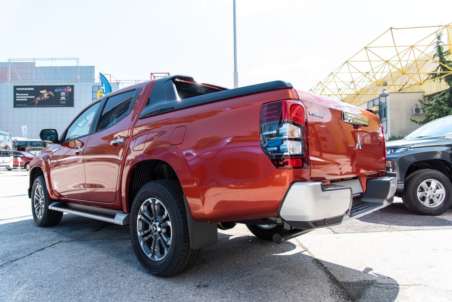 Rear and side view of pickup with distinctive rear lights and alloy wheels