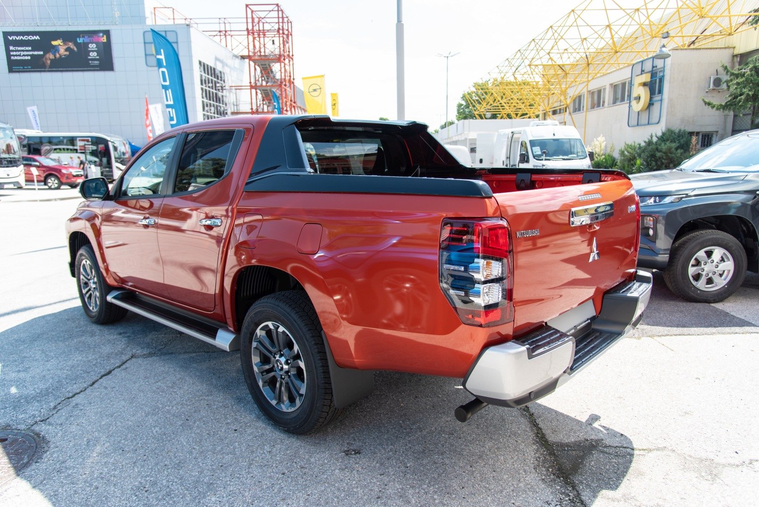Rear and cargo bed view with LED tail lights and alloy wheels