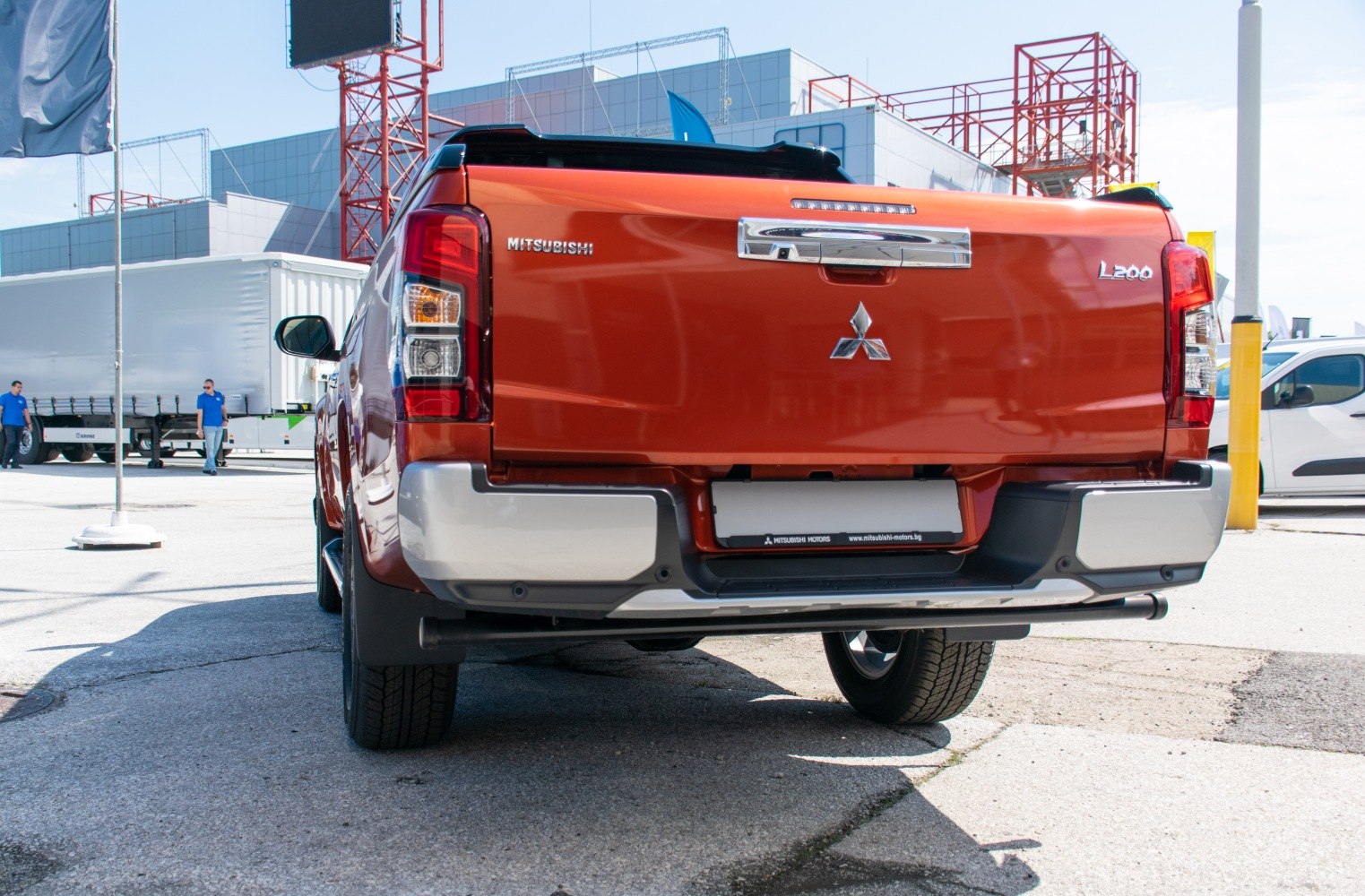 Rear view of a pickup with bold tailgate and modern taillights