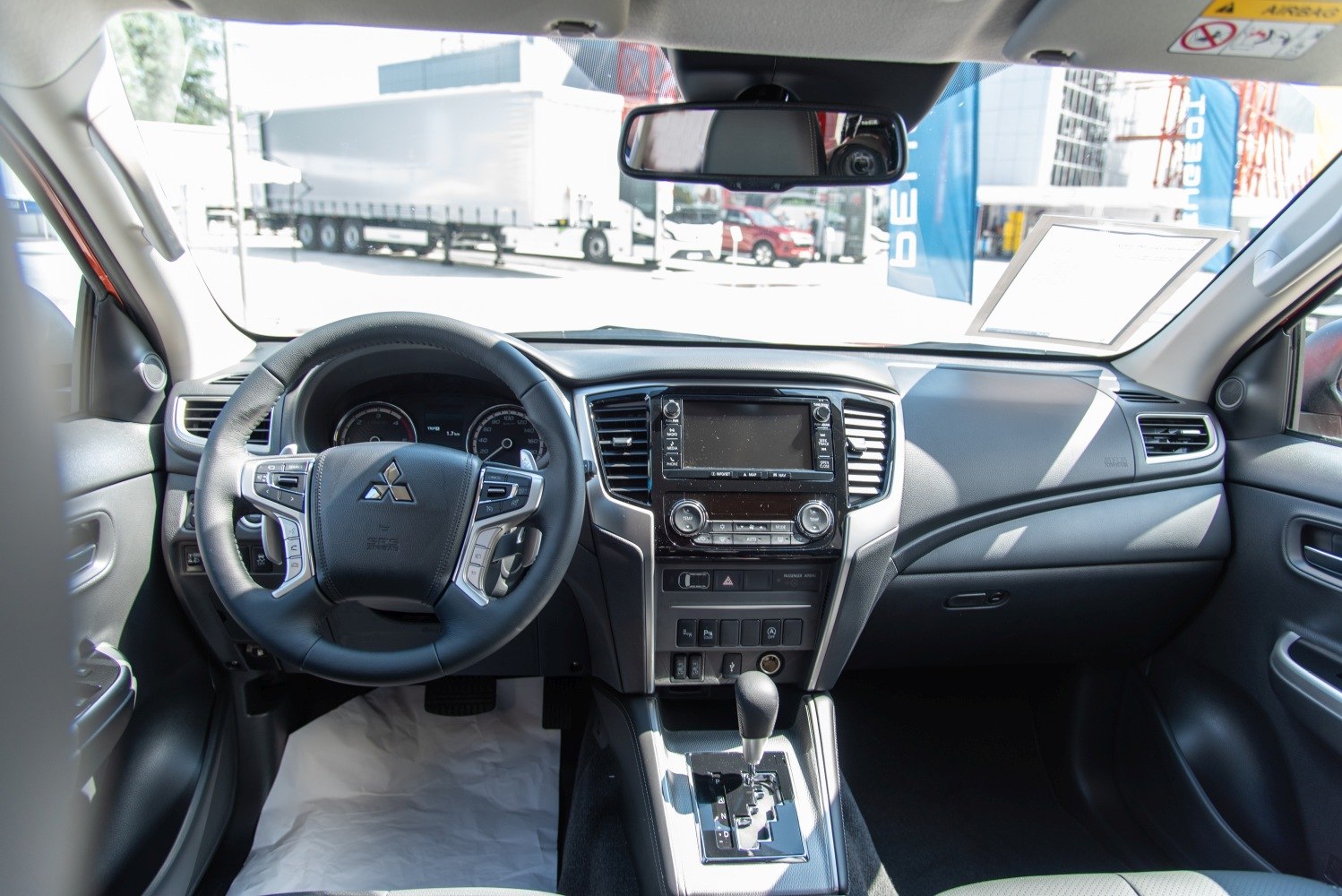 Dashboard and steering wheel with infotainment screen and automatic gear selector
