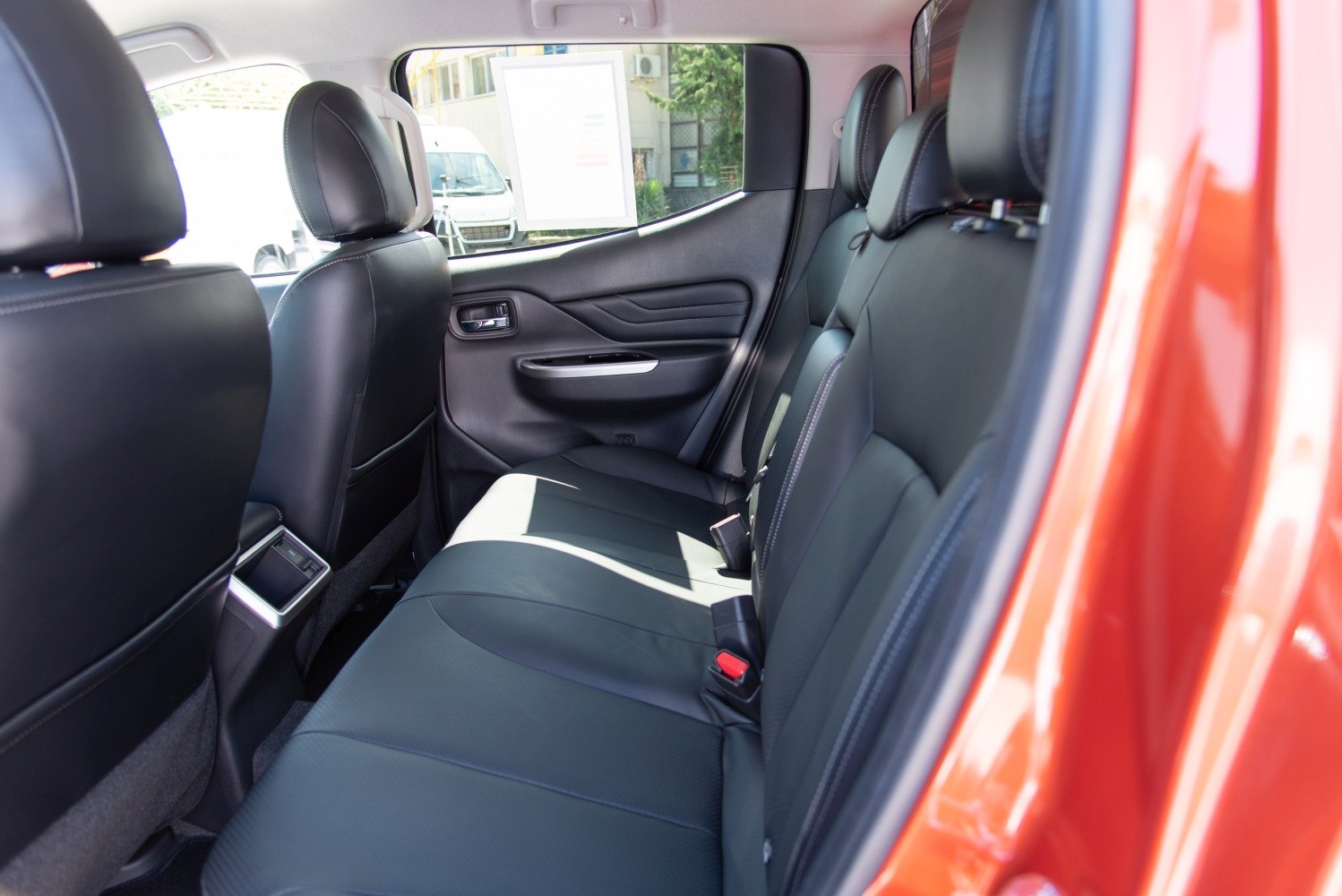 Spacious rear seats with black leather upholstery and modern styling