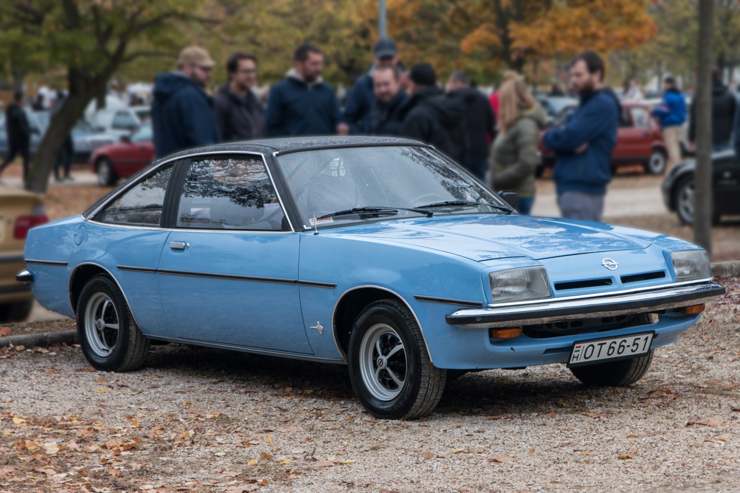 Blue vintage coupe with sleek 1970s European sports car design.