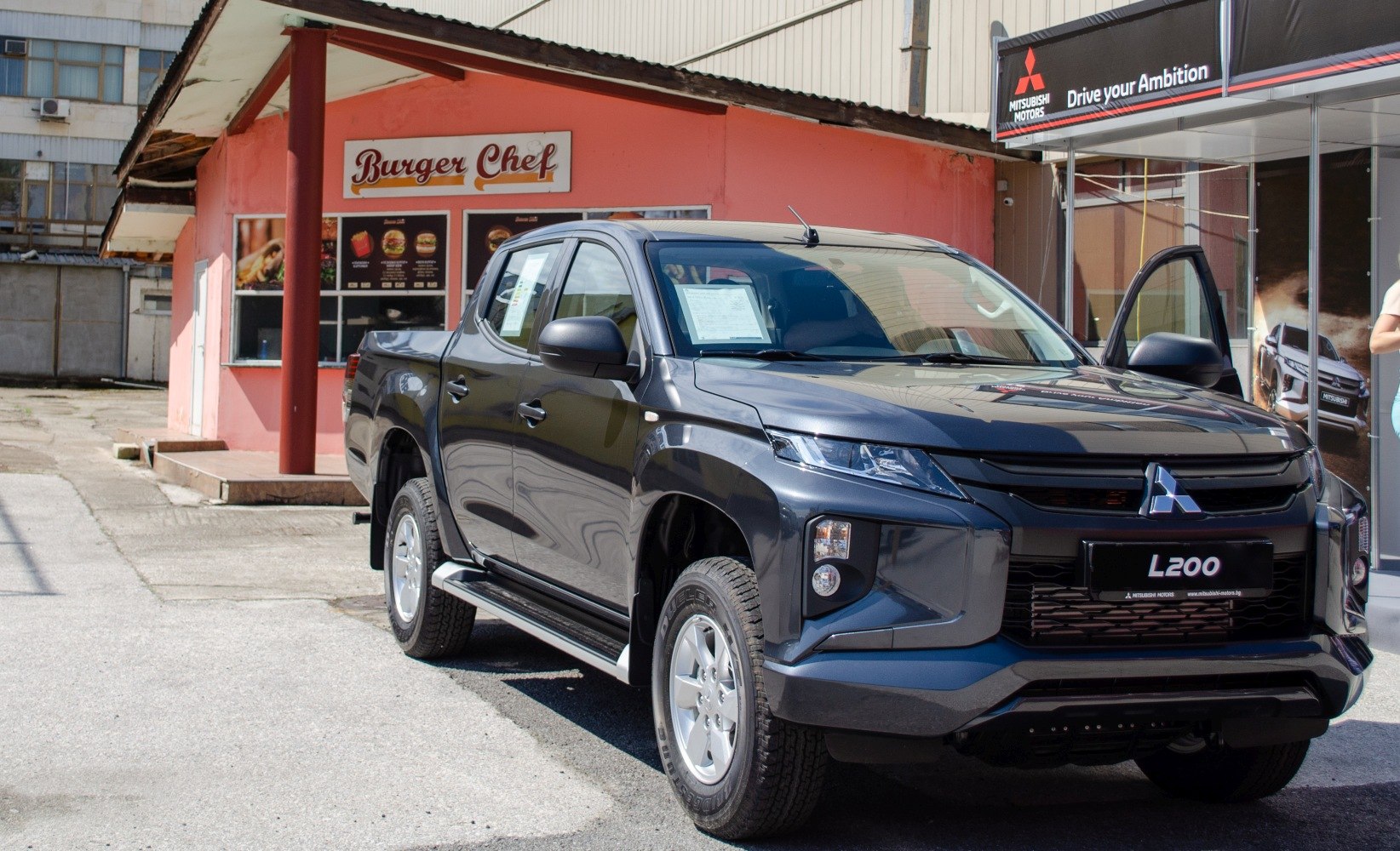 Front and side view of modern double cab pickup truck with aggressive styling