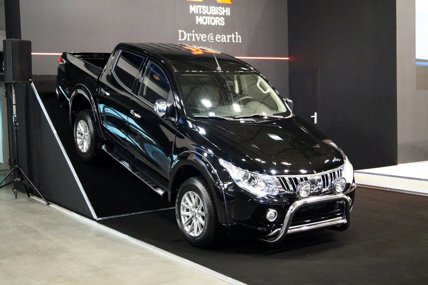 Black double cab pickup with bull bar and alloy wheels