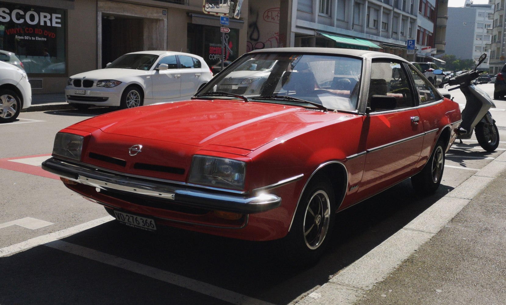 Vintage red coupe with rectangular headlights and chrome bumper