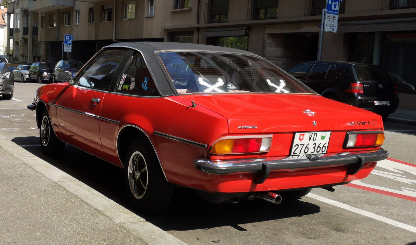 Red coupe with vintage design and automatic badge