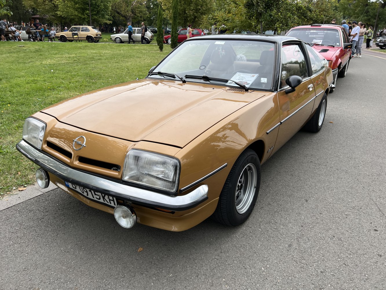 Classic sports coupe front with rectangular headlights and chrome bumper