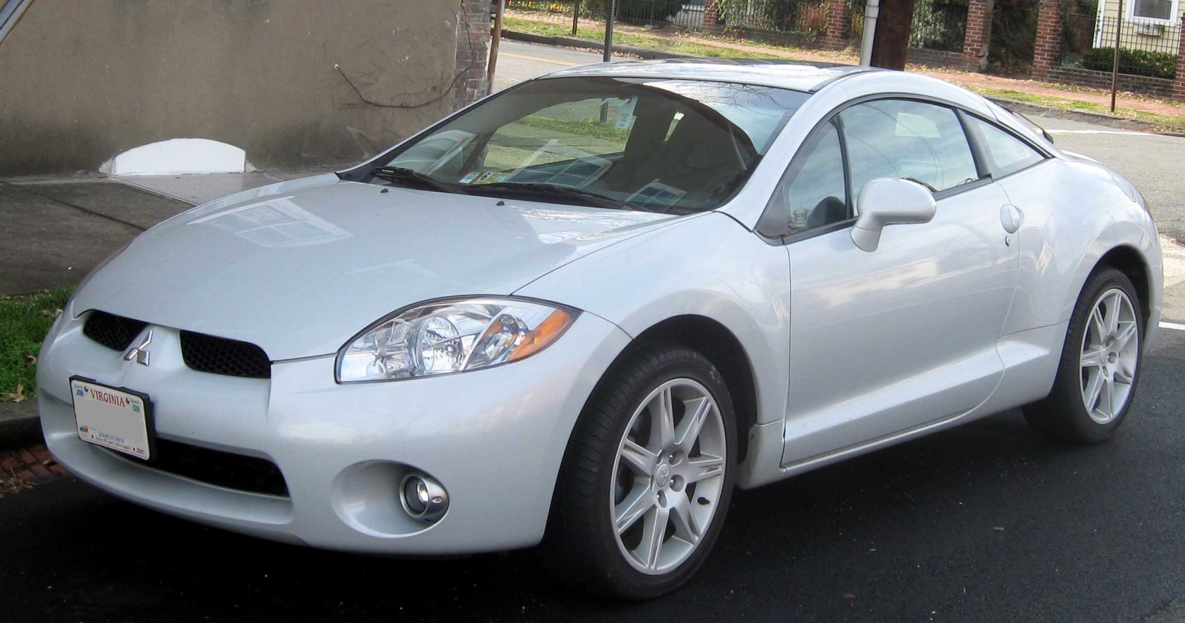 Silver sports coupe with distinctive headlights and alloy wheels