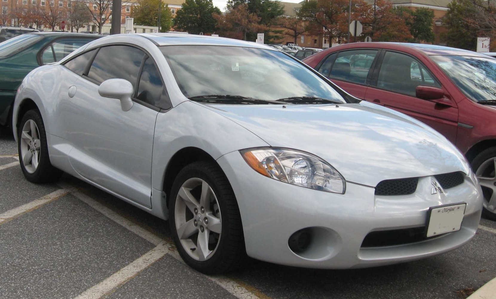 Silver sporty coupe angled front view with sleek headlights
