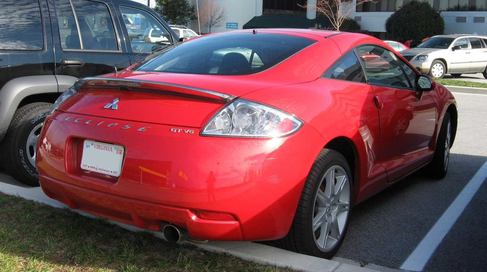 Sporty coupe rear with integrated spoiler and clear tail lights