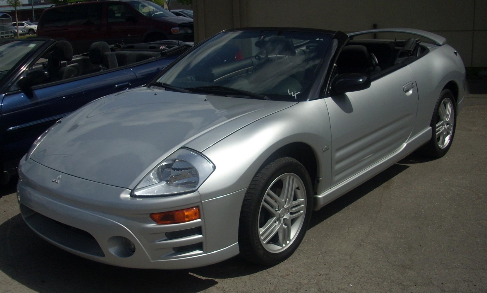 Silver convertible front view with sporty alloy wheels and aerodynamic design