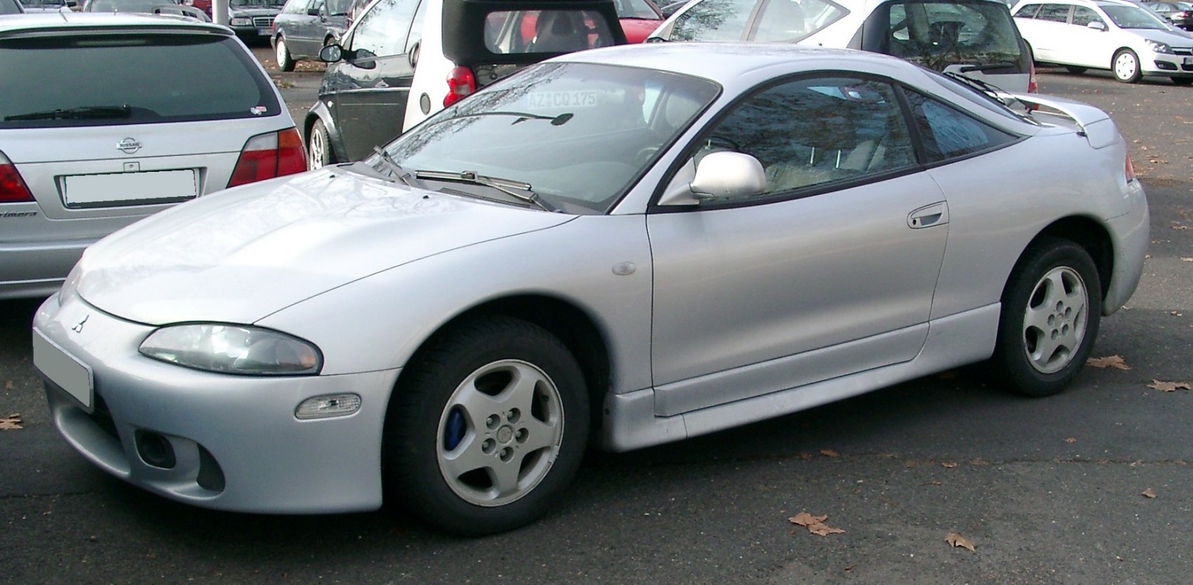 Sleek silver coupe with 5-spoke alloy wheels and rear spoiler