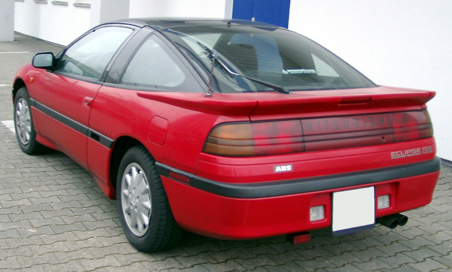 Rear view with spoiler and distinctive taillights of a sport coupe