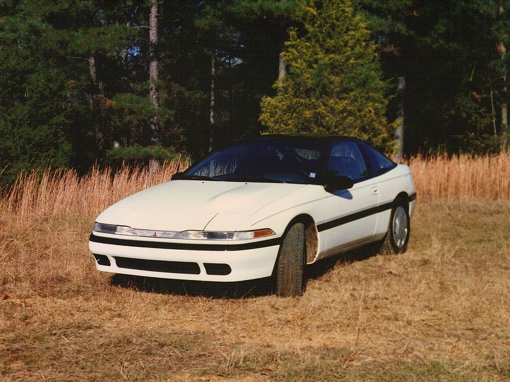 White coupe with pop-up headlights and black trim