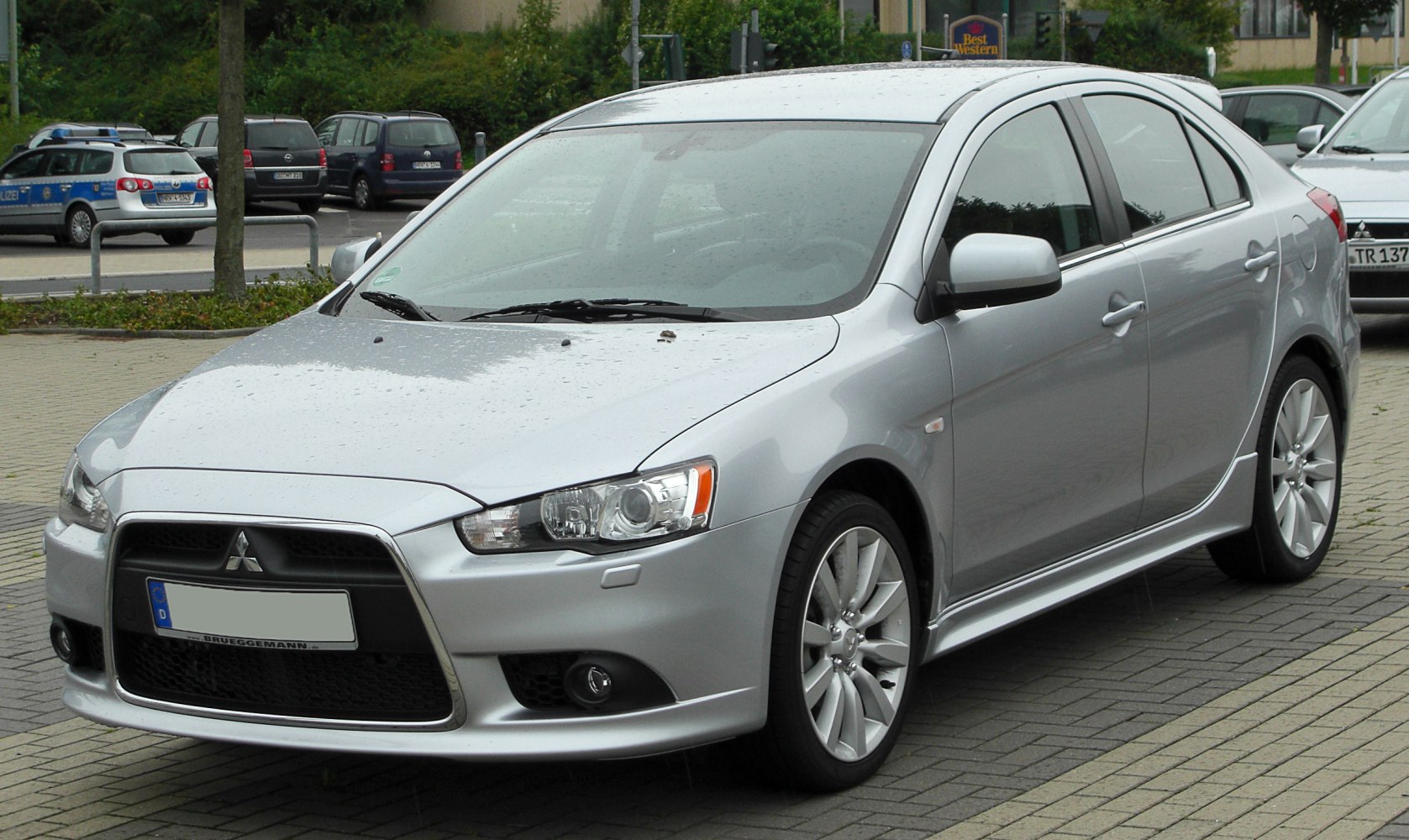 Silver sportback sedan with alloy wheels and sharp headlight design