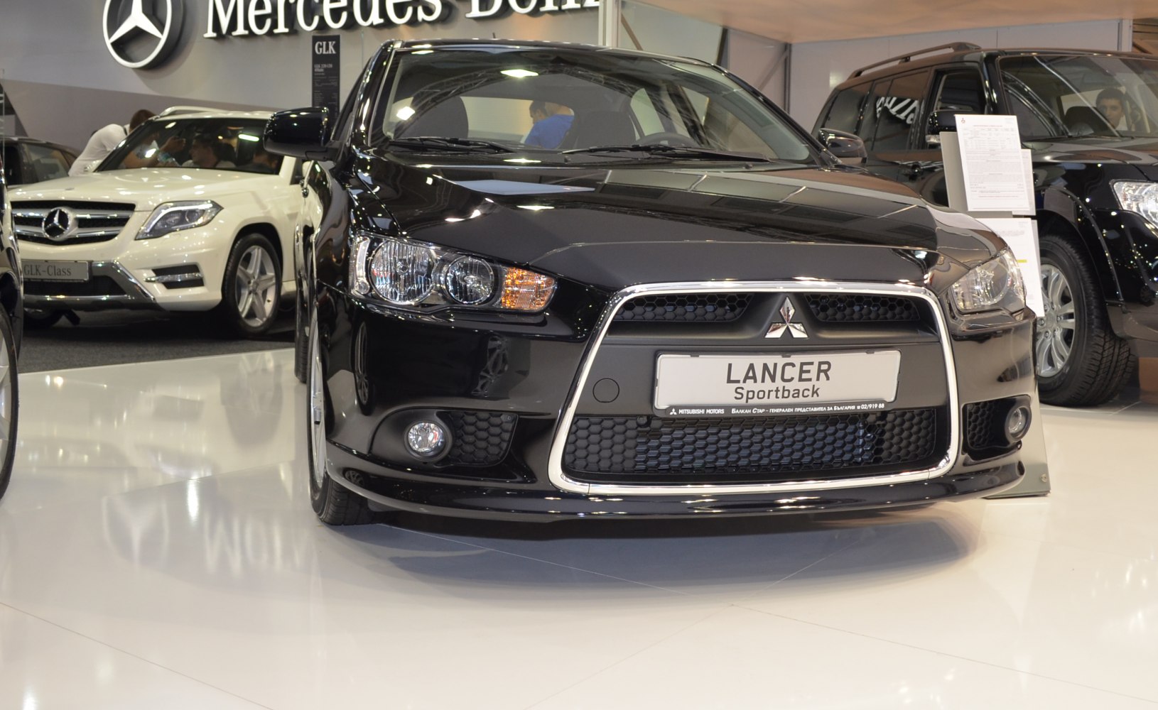 Close-up of front grille and headlights with sporty design and chrome trim