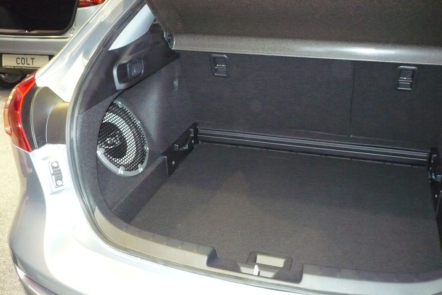 Spacious car trunk with integrated speaker on side panel