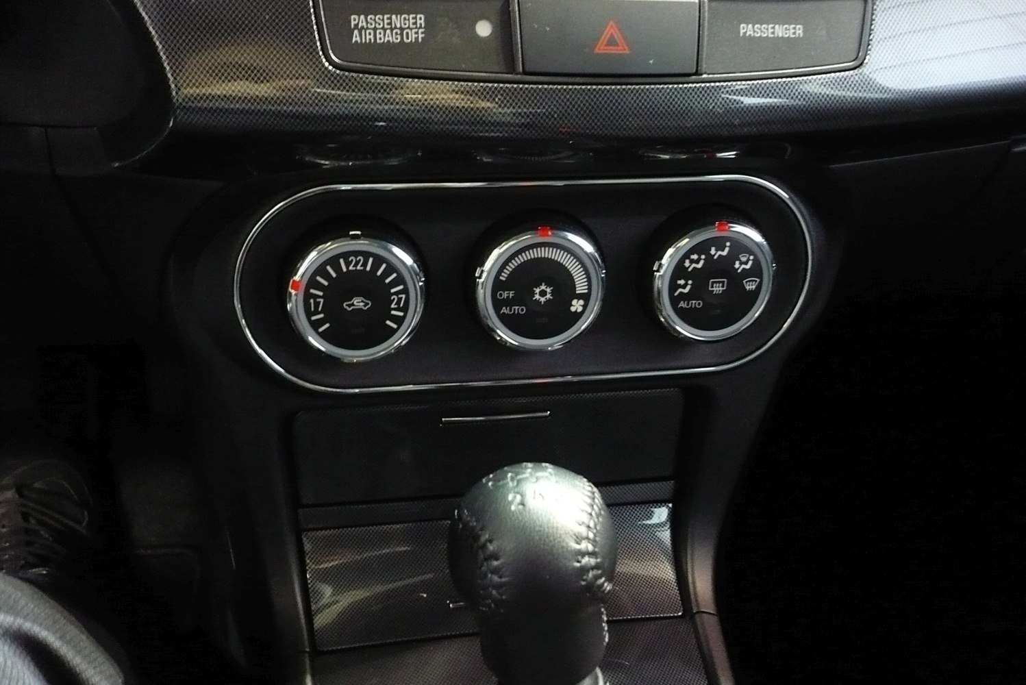 Interior climate control panel and manual gear shift lever