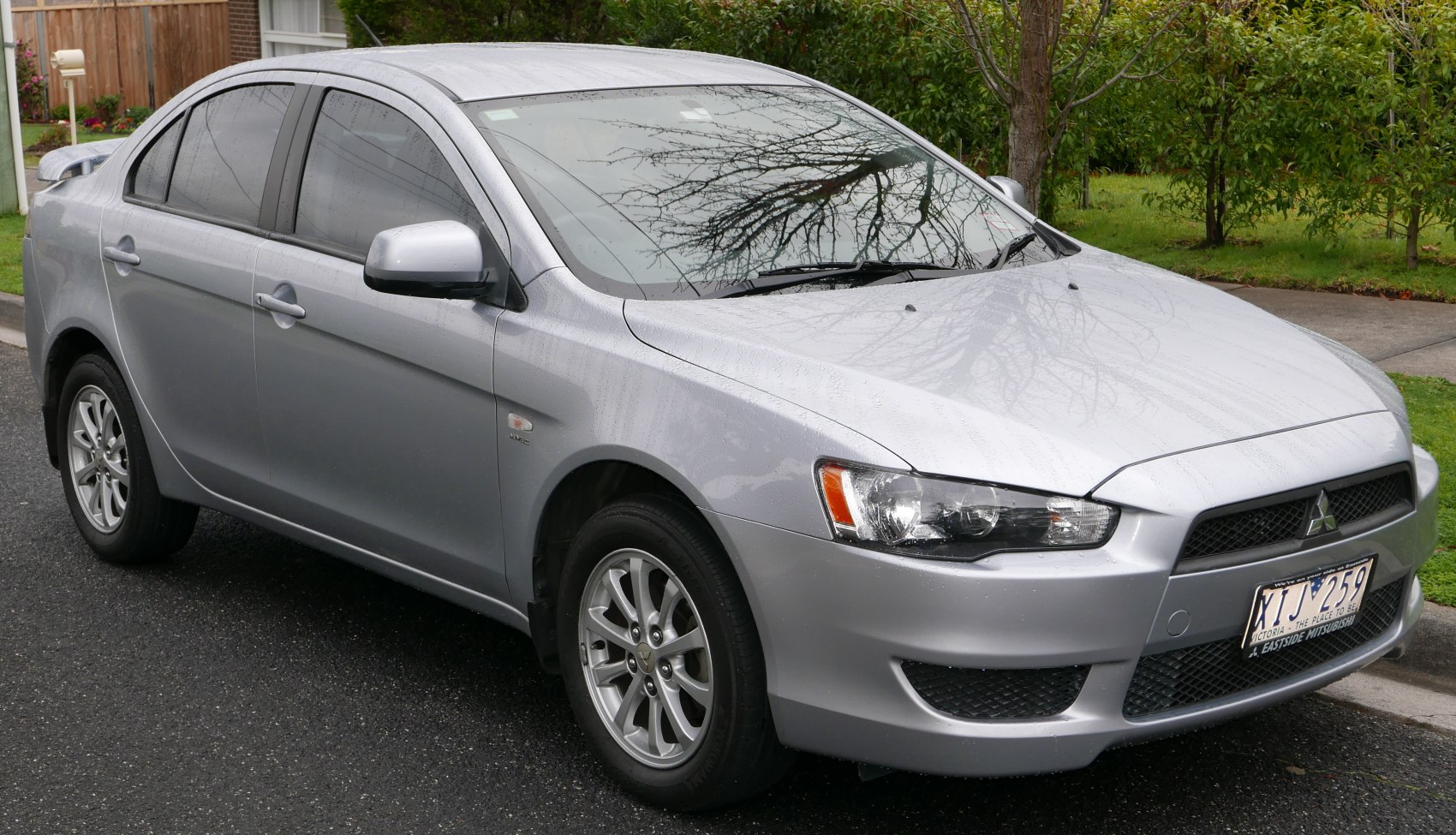 Silver sedan with alloy wheels and tinted windows