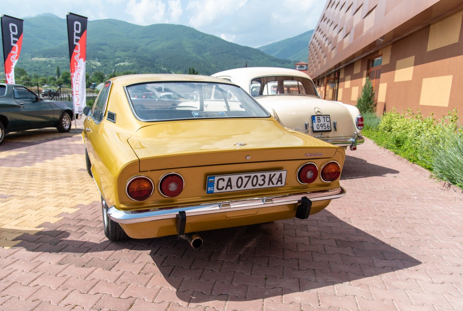 Rear view of classic vintage hatchback with dual round taillights