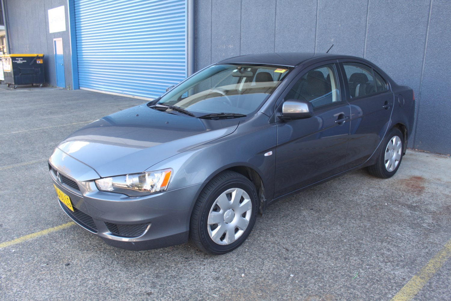 Sporty gray sedan with sleek headlights and alloy wheels