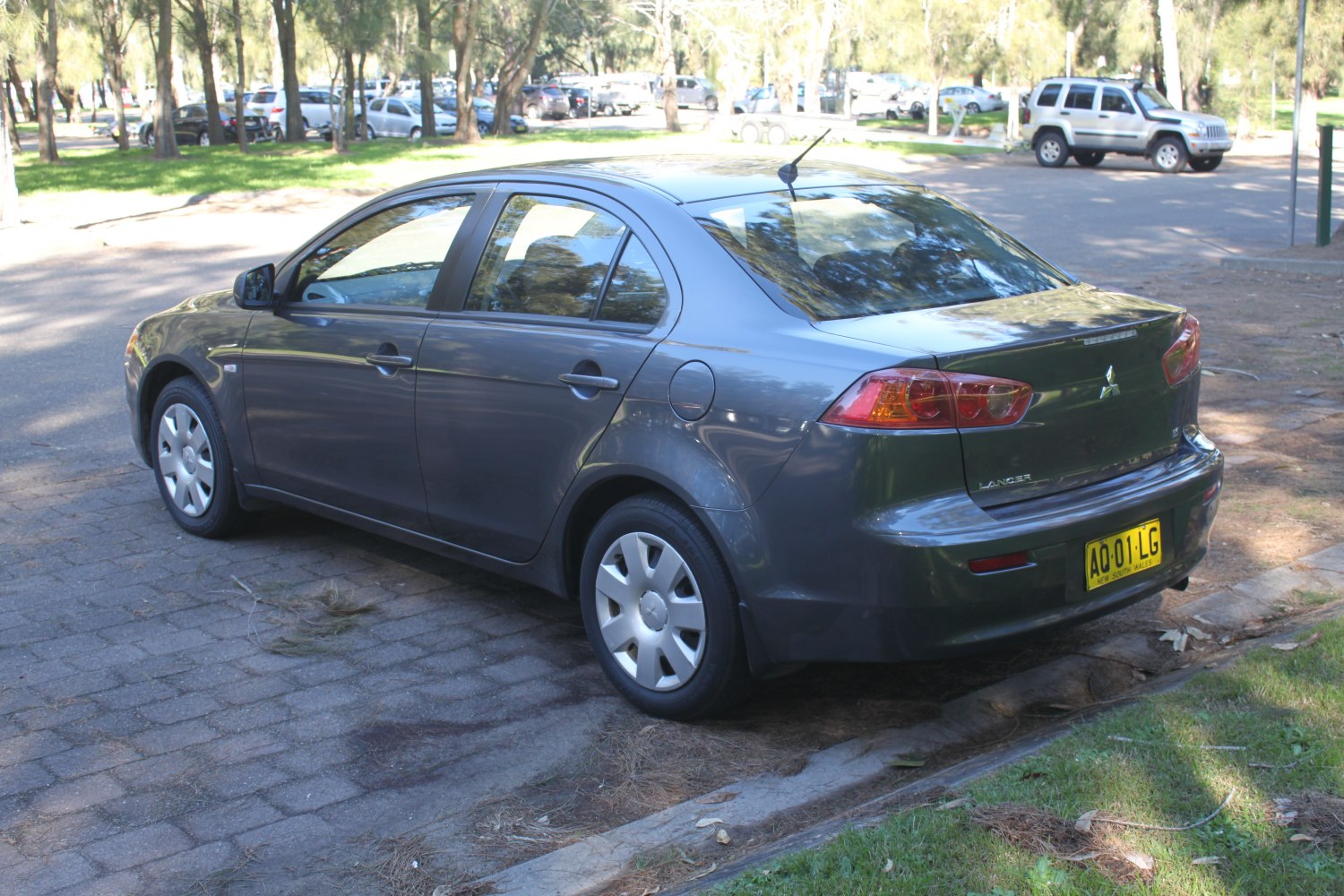 Rear and side view of a sedan with distinctive taillights and sleek design