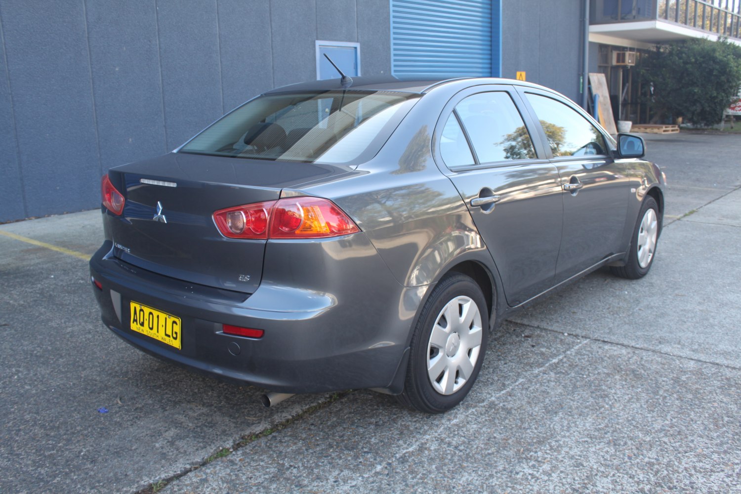 Rear-side view of sedan with distinct tail lights and body shape