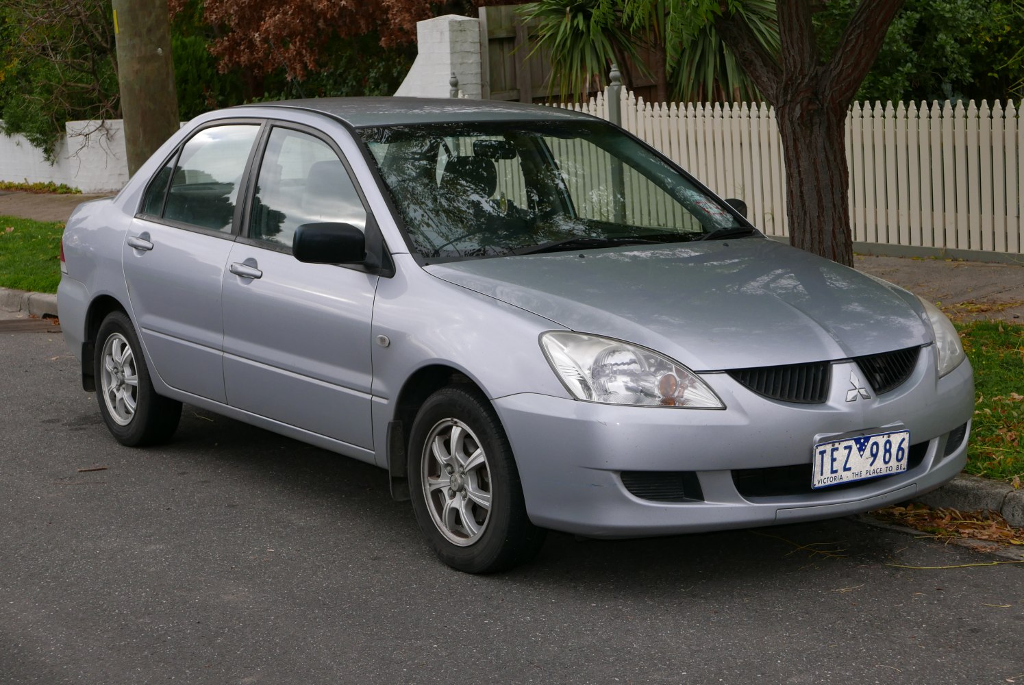 Silver sedan with sharp headlights and alloy wheels