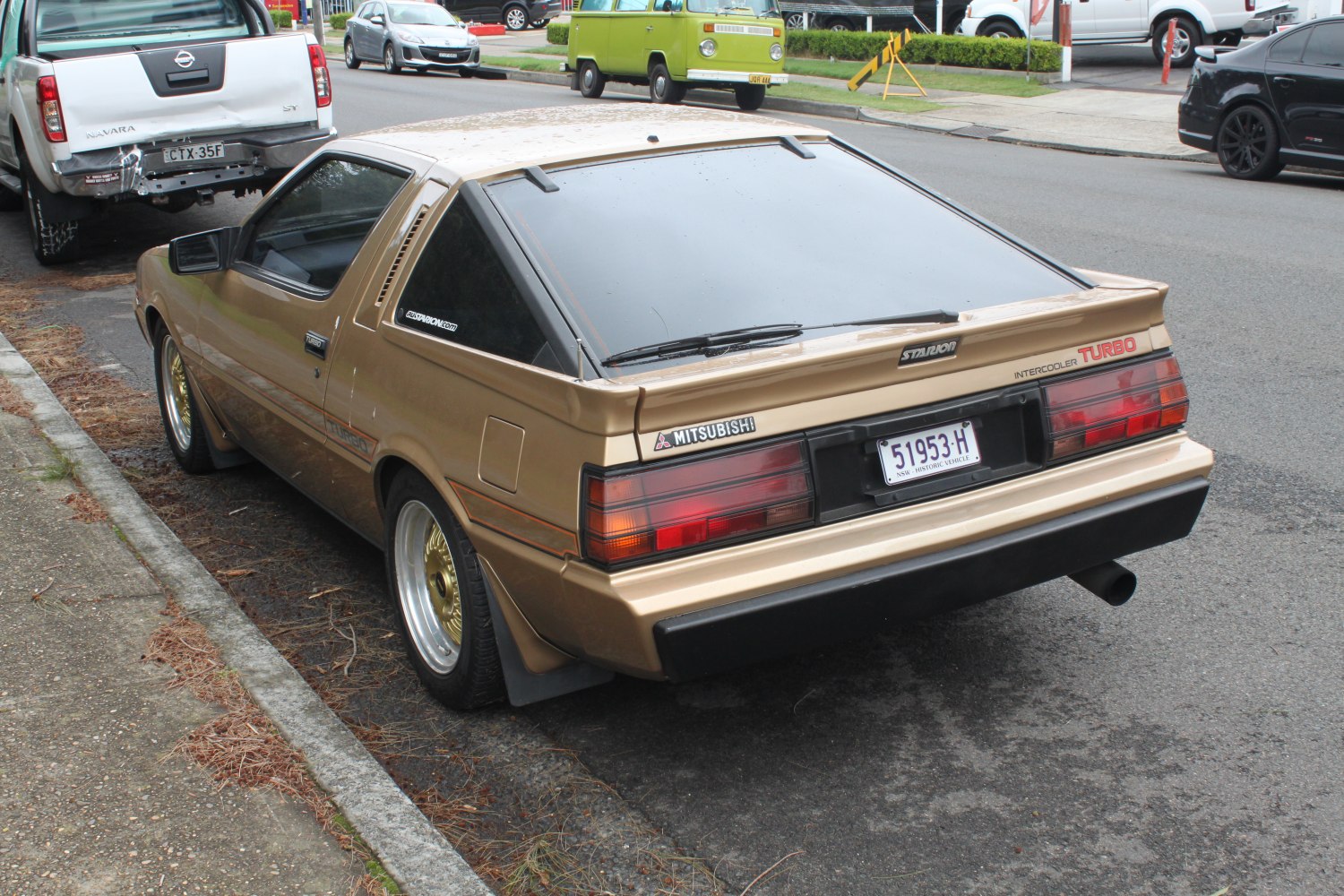 Retro turbo sports coupe rear with wide window and spoiler
