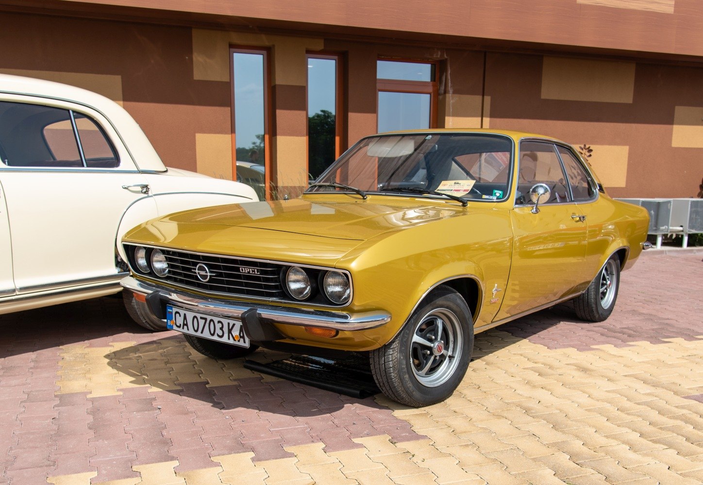 Yellow coupe with round headlights and chrome bumper