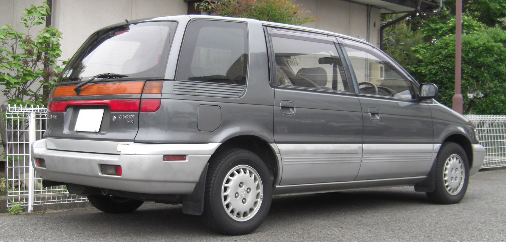 Minivan rear side view with two-tone paint and classic tail lights