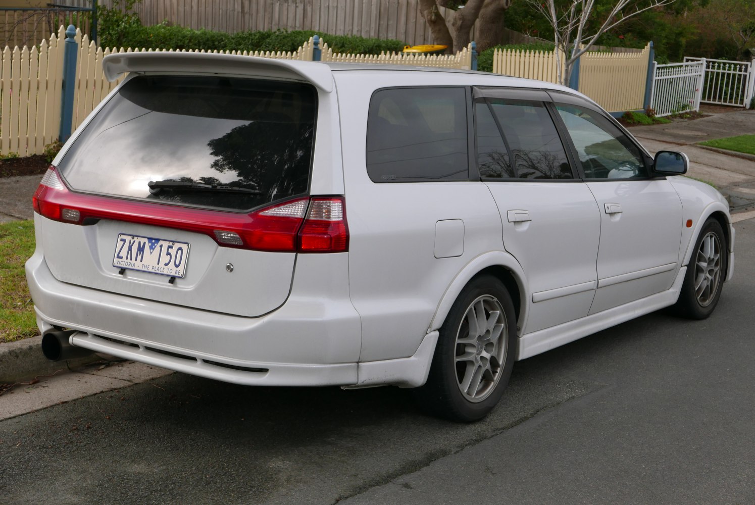 Rear view of wagon with prominent spoiler and taillights