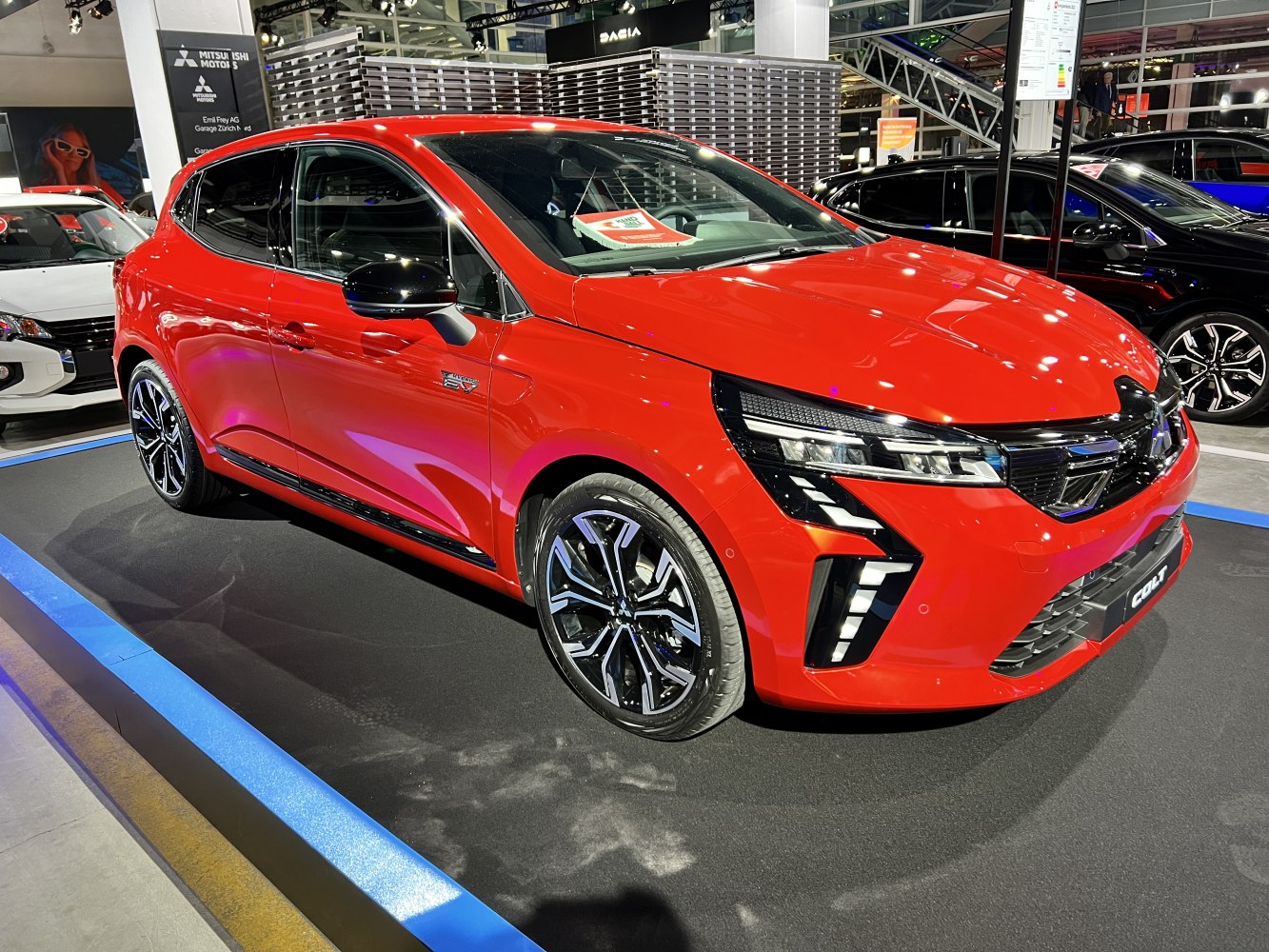 Red compact hatchback with LED headlights and alloy wheels
