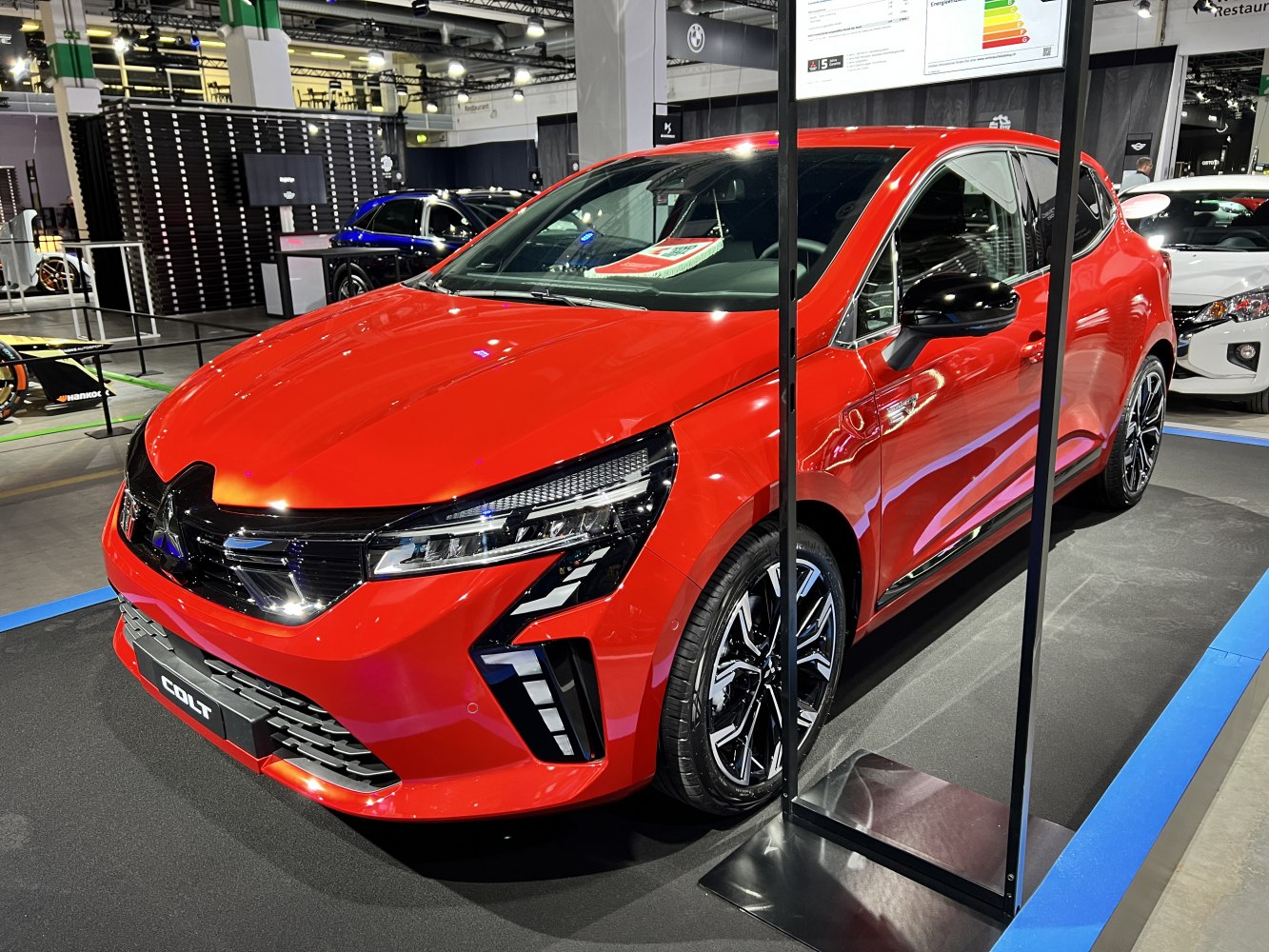 Compact hatchback in bright red with LED headlights and black alloy wheels