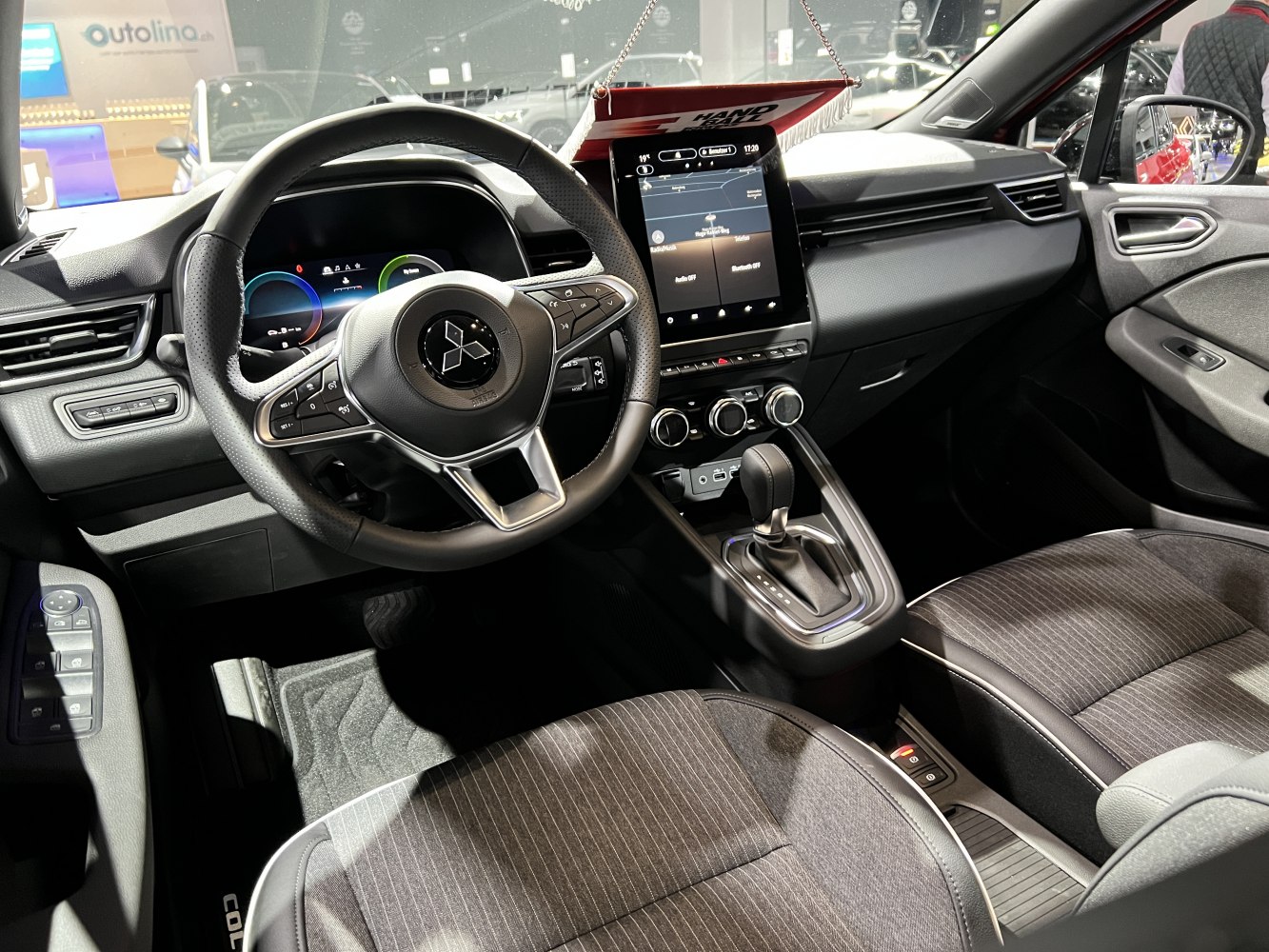 Digital instrument cluster and touchscreen infotainment with modern steering wheel controls