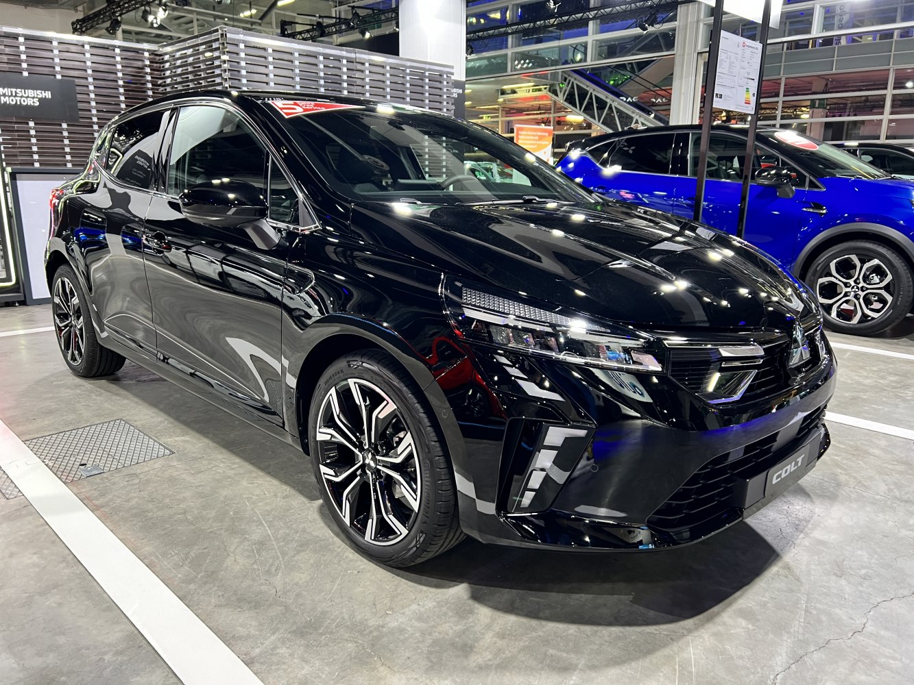 Black hatchback with LED headlights and sporty alloy wheels.