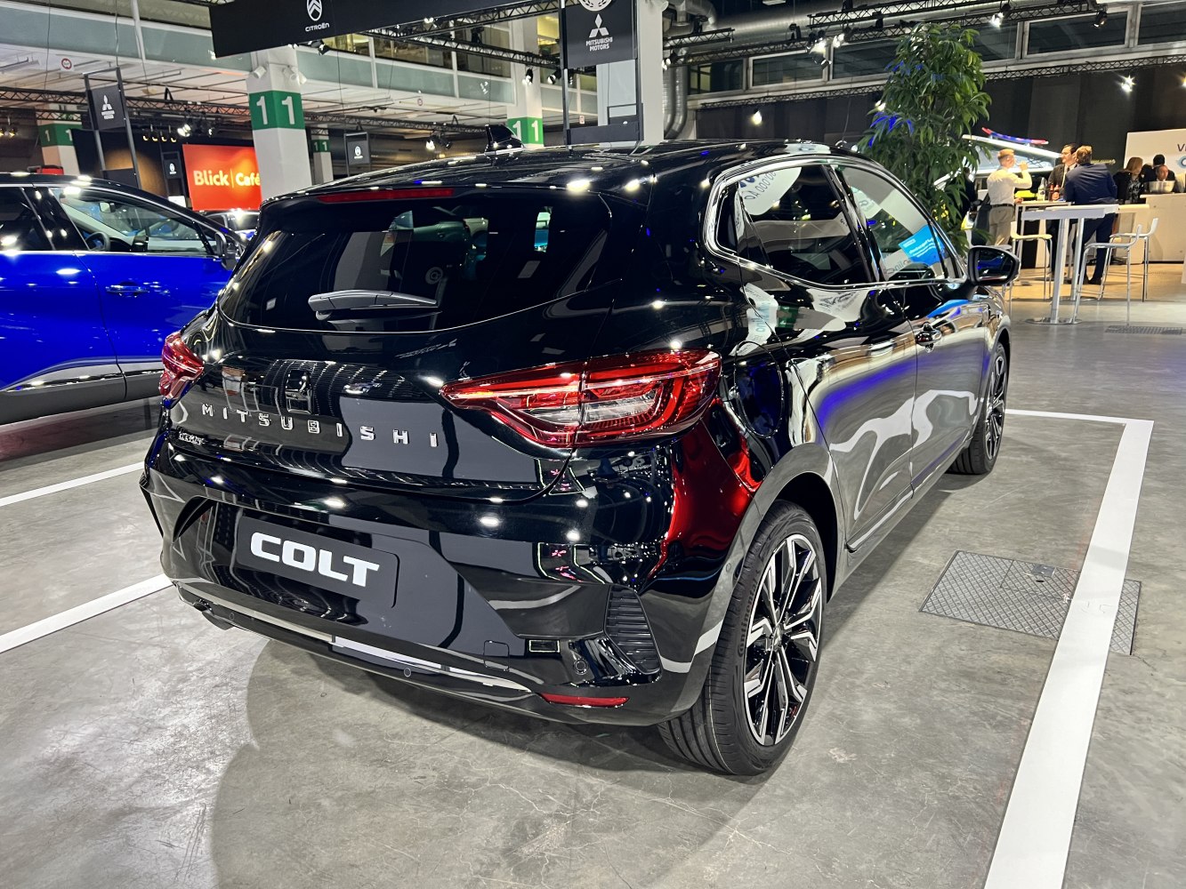 Rear view of black hatchback with LED tail lights and alloy wheels