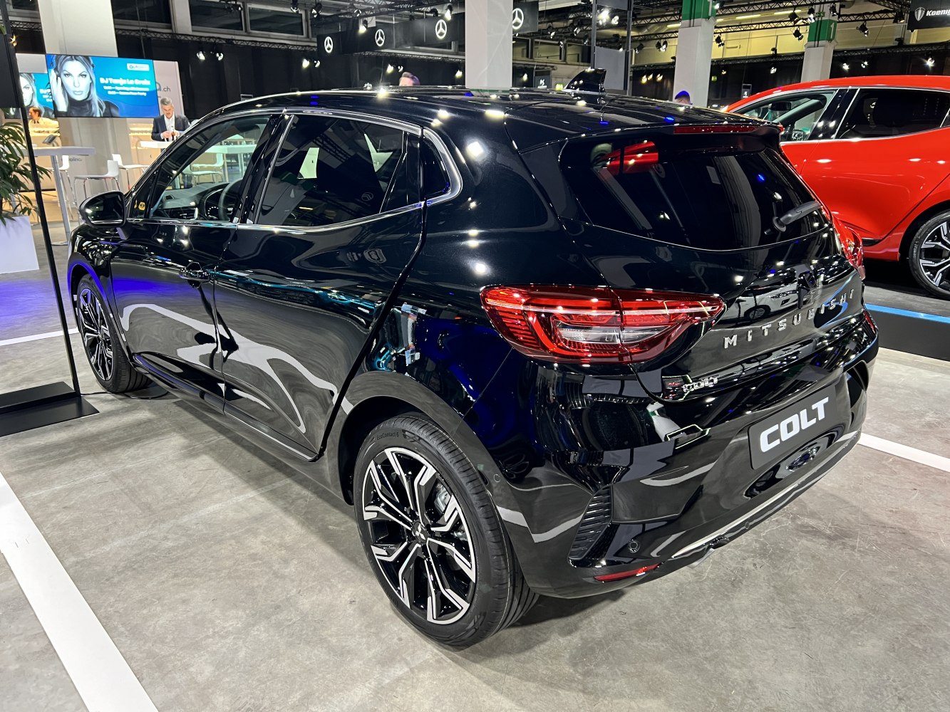 Black hatchback with alloy wheels and distinctive rear lights