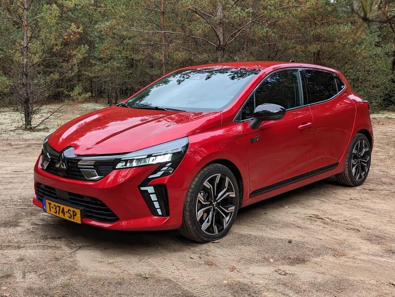 Red hatchback with LED headlights and sporty wheels