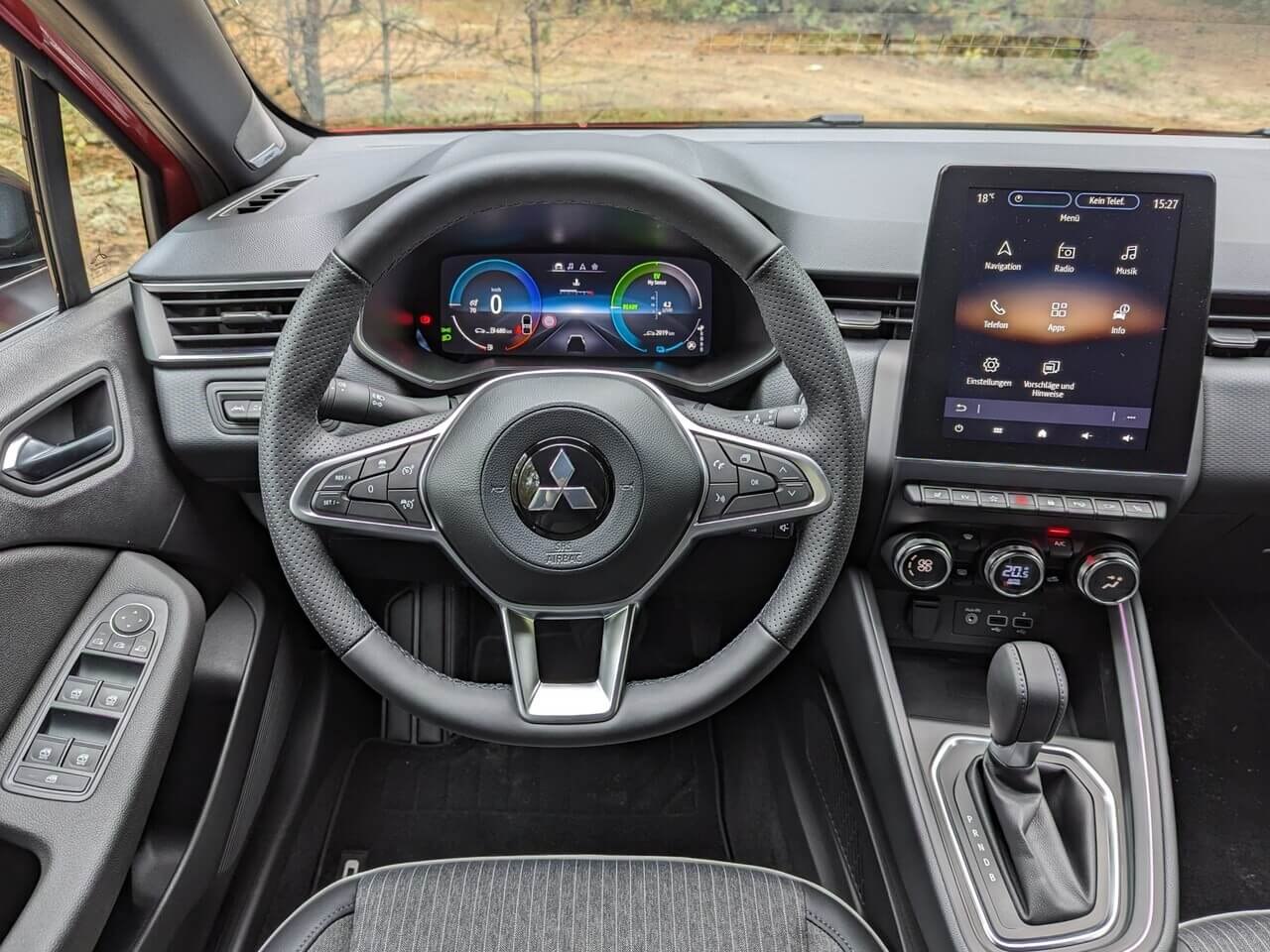 Digital instrument cluster, multifunction steering wheel, and touchscreen infotainment.