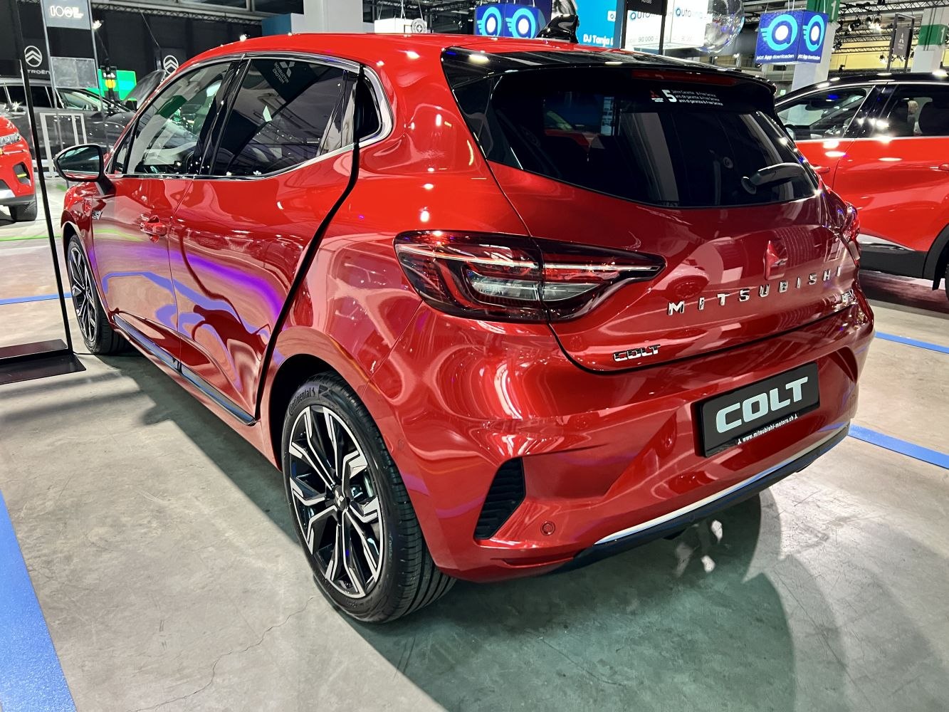 Rear view of modern hatchback with detailed taillights and alloy wheels
