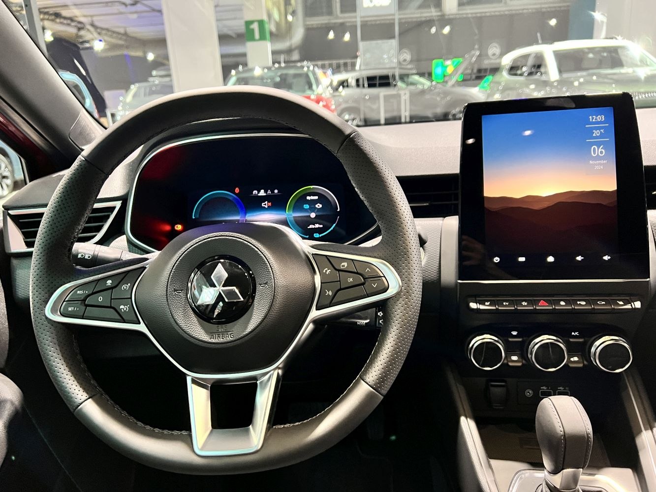 Steering wheel, digital cluster, touchscreen infotainment, climate controls