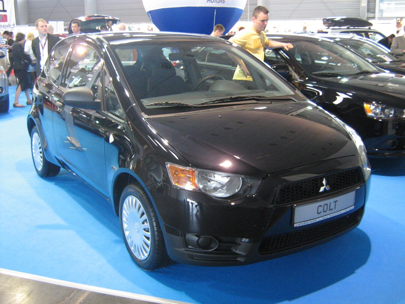 Black 3-door compact hatchback front three-quarter view