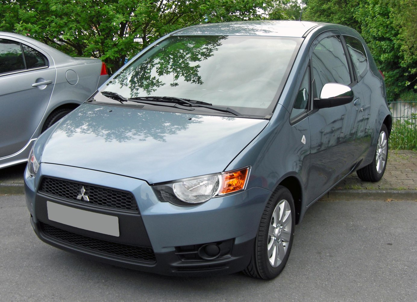 3-door hatchback front with distinctive headlights and grille