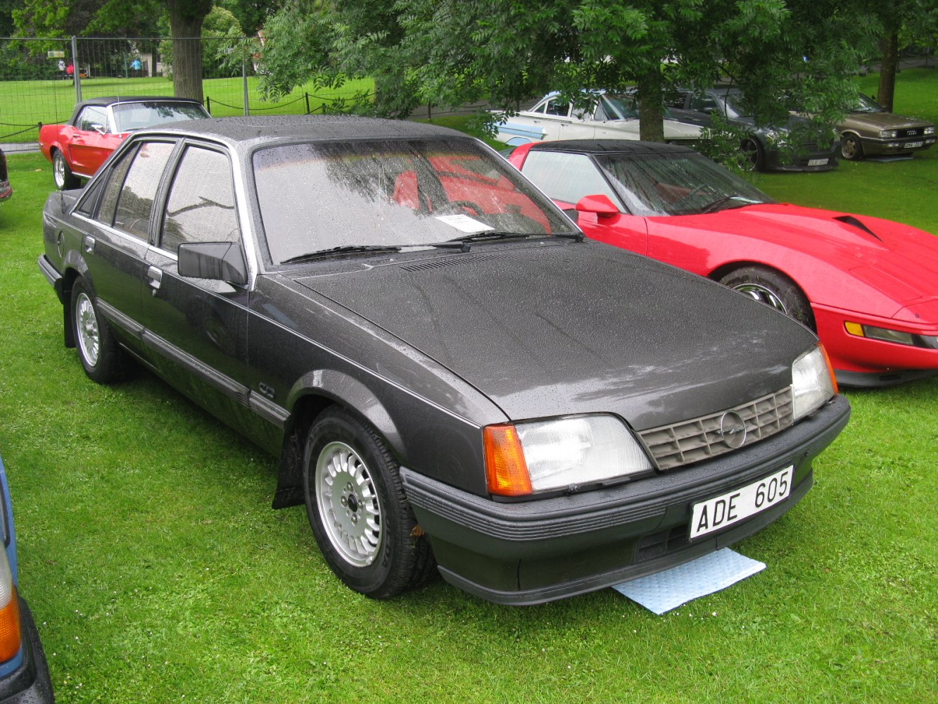 Boxy headlights and classic front grille on a 1980s sedan
